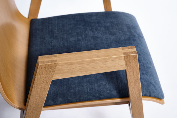 Lavabis stacking chair upholstered wood with armrest