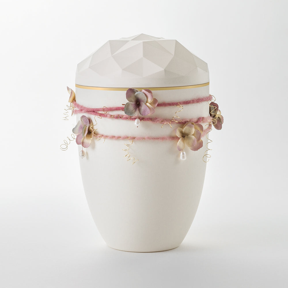 Kaufen auf-urne-kristall-cremeweiss Samosa Urne Wickelschmuck rosé mit Perlen Reliefurne